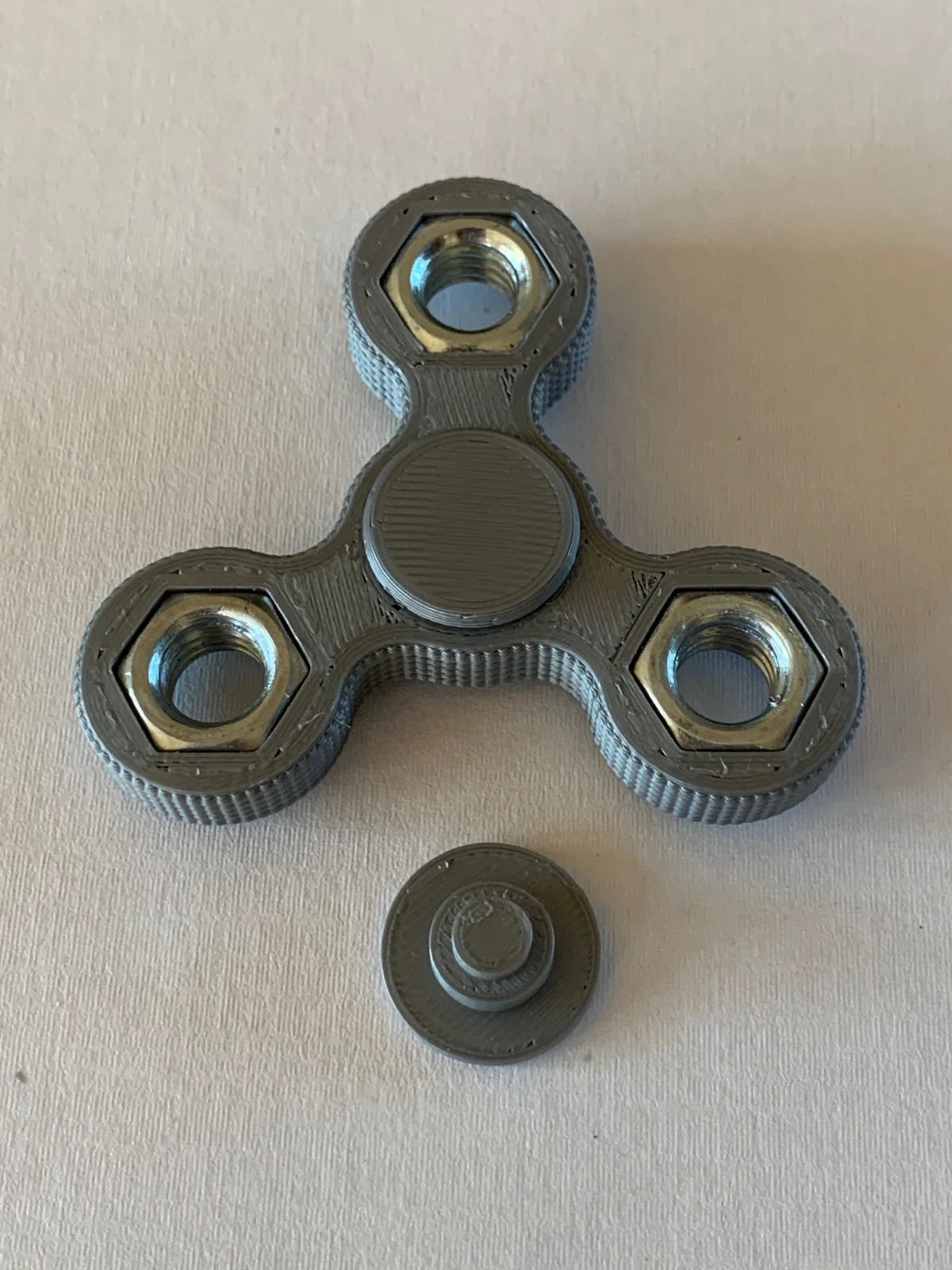 3D-printed fidget spinner with hex nut weights